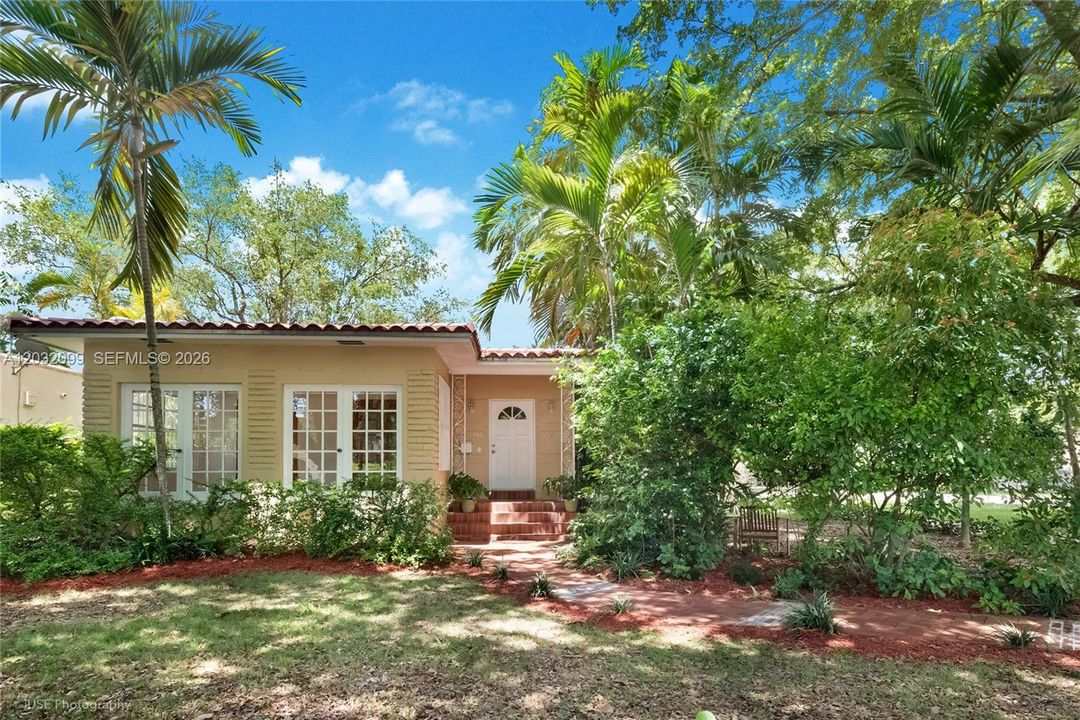 Front photo shows the property has a typical Coral Gables charm.