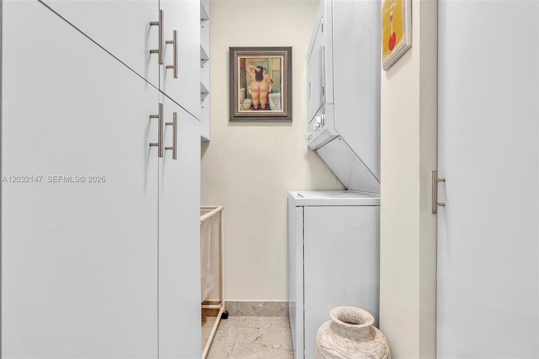 A SEPARATE LAUNDRY ROOM WITH EXTRA STORAGE MAKES THIS UNIT EVEN MORE SPECIAL!