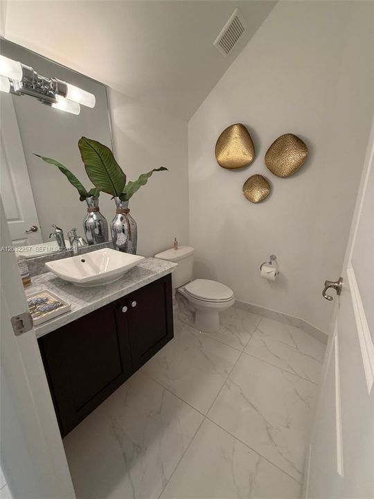 HALF BATHROOM ON FIRST FLOOR