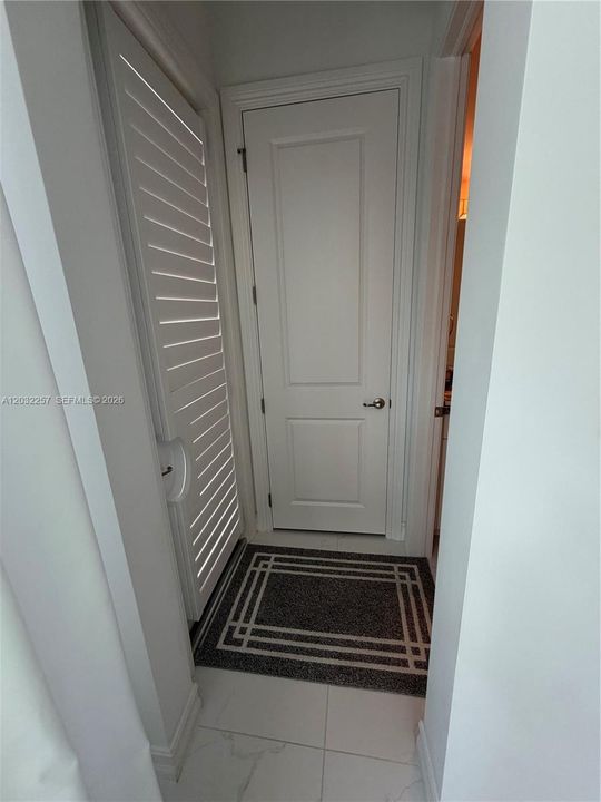 DOOR LEADING TO POOL DECK AND ACCESS TO CABANA BATH