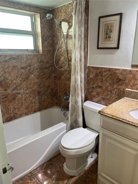 Full bathroom with bathtub