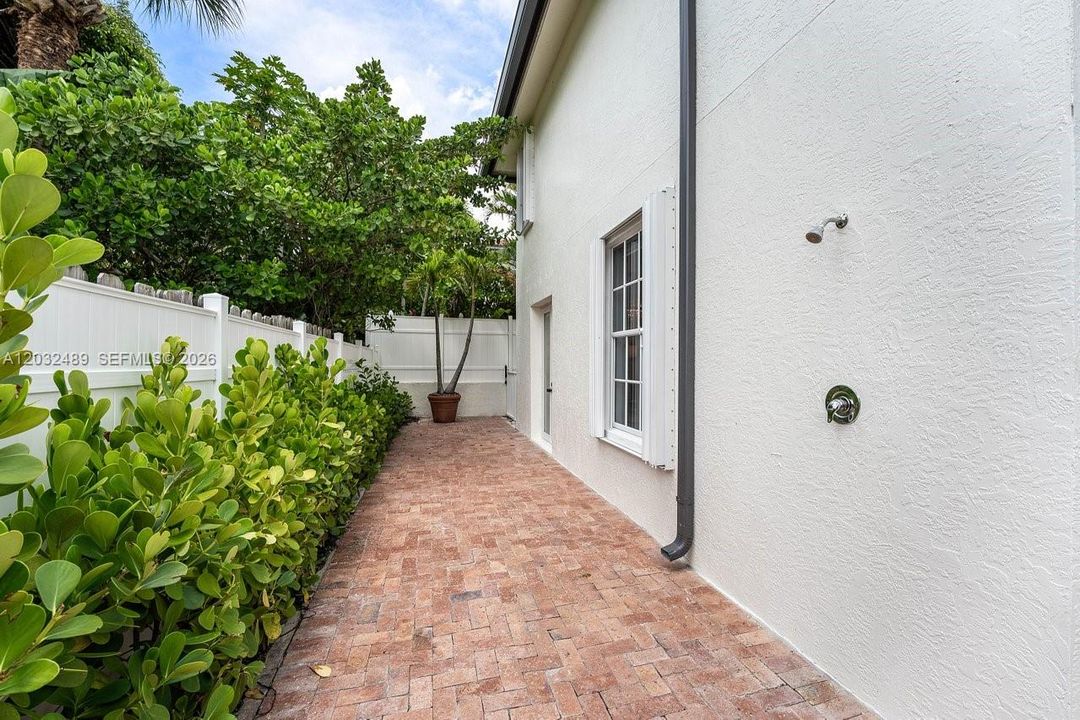 rear outdoor dining area off dining room, outdoor shower