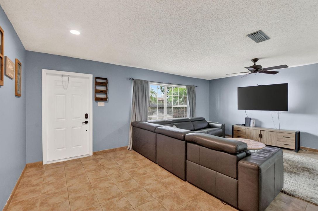 View of front door from living room