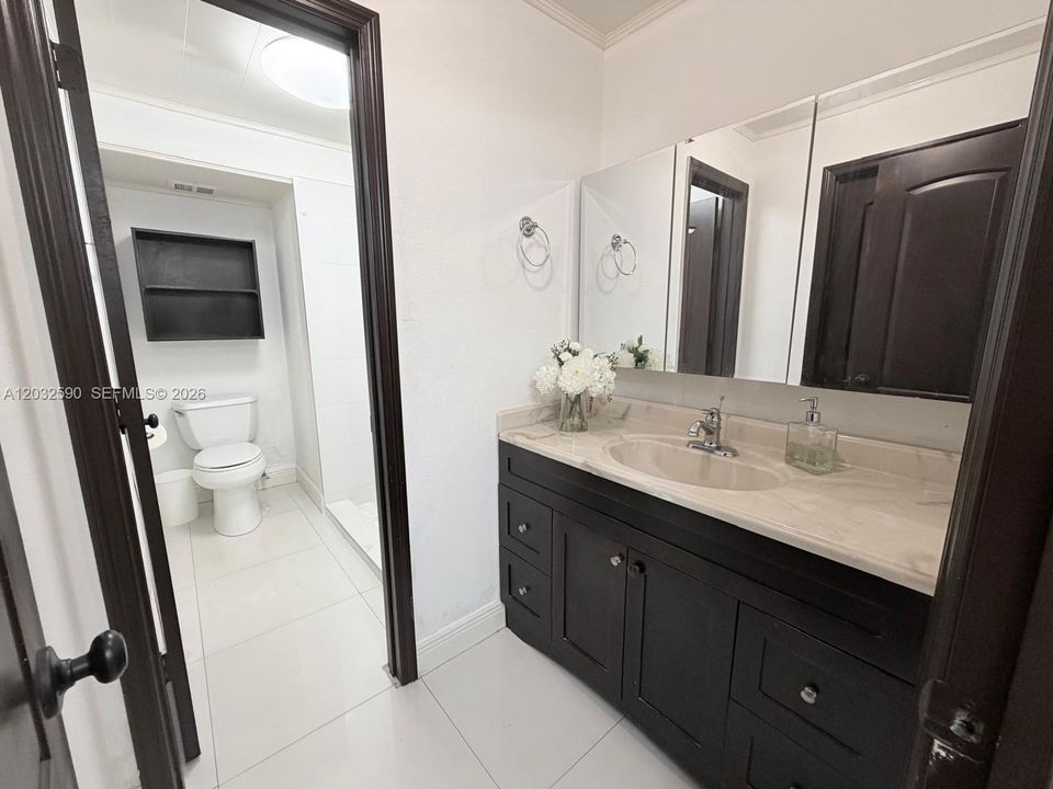 Bathroom #3 doubles as a guest bathroom and privately leads into 3rd bedroom
