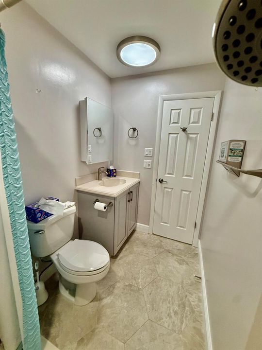 Guest bath exit door facing hallway