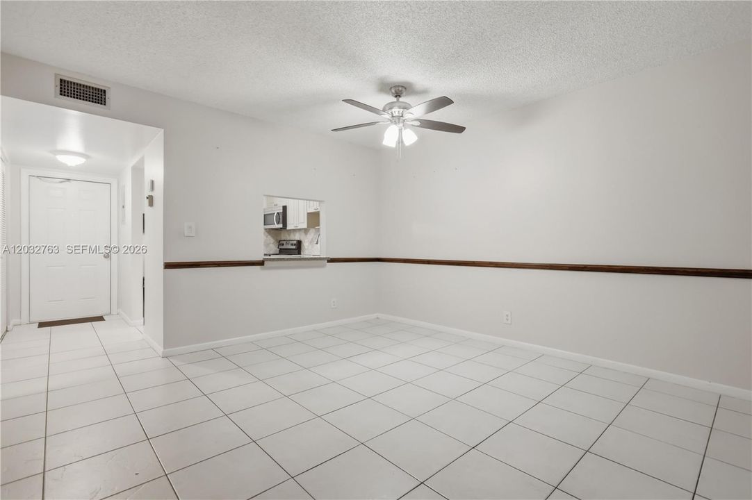 Facing front entrance & kitchen