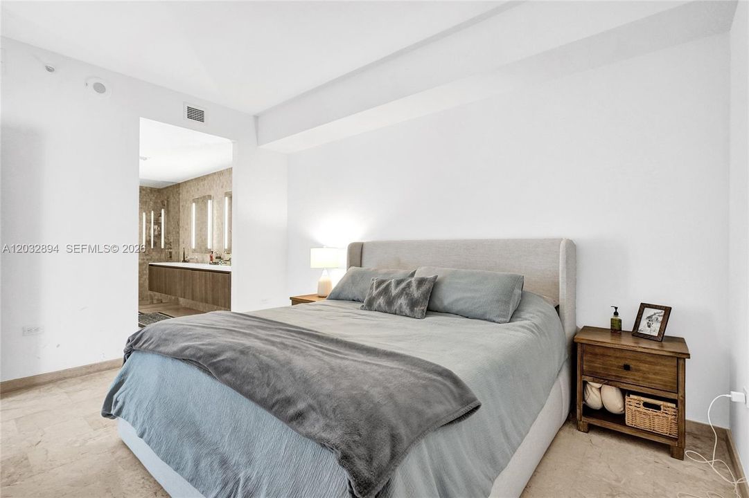 Ample master bedroom with electric blinds