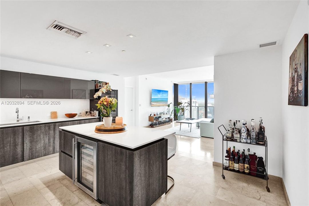 Flexible den/dining area connecting to the open living and kitchen layout.