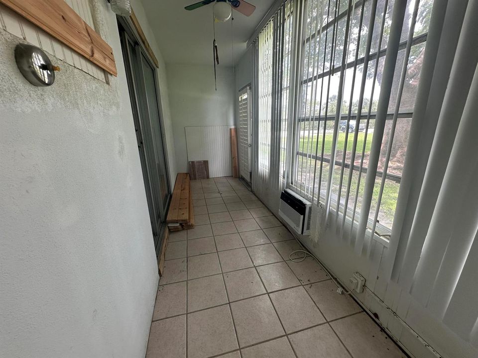 Glass enclosed patio with door