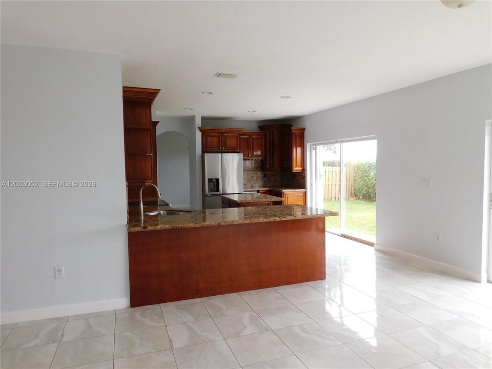Family room view to kitchen great snack counter.