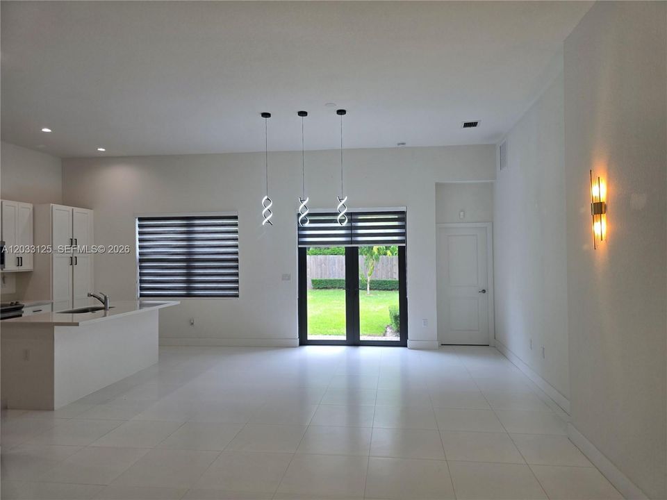 In this open concept design, gives flexibility to this area. It can serve either as a dining area or a living area.