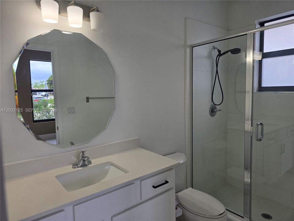 3rd Bathroom that is in the 4th Bedroom. These two rooms together can be used as a secondary suite for visiting guests or in a multigenerational home.