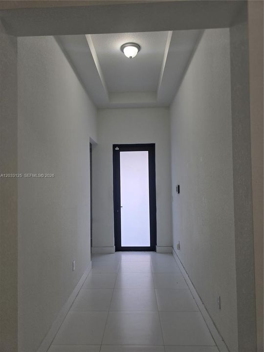 The foyer area that leads to the front door.