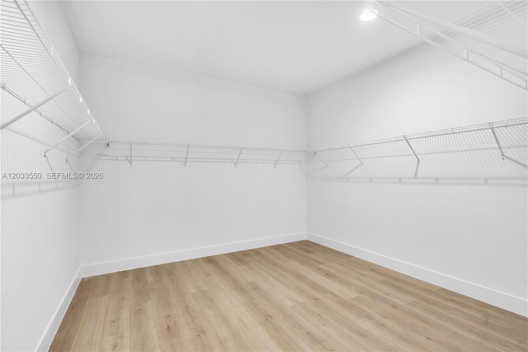 1 of 2 Primary walk-in closets