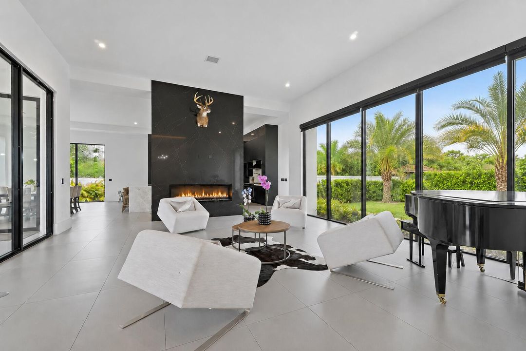 9741 SE Gomez piano room with fire place