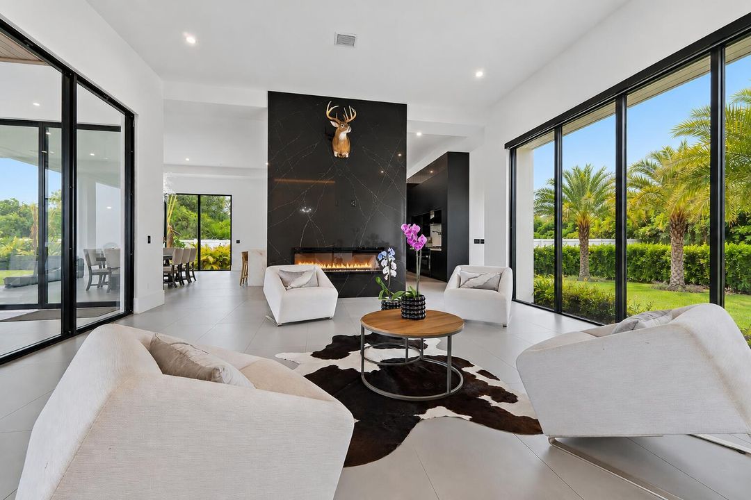 9741 SE Gomez piano room with fire place