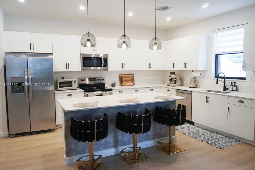 Kitchen with large Island & Stainless Steel Appliances