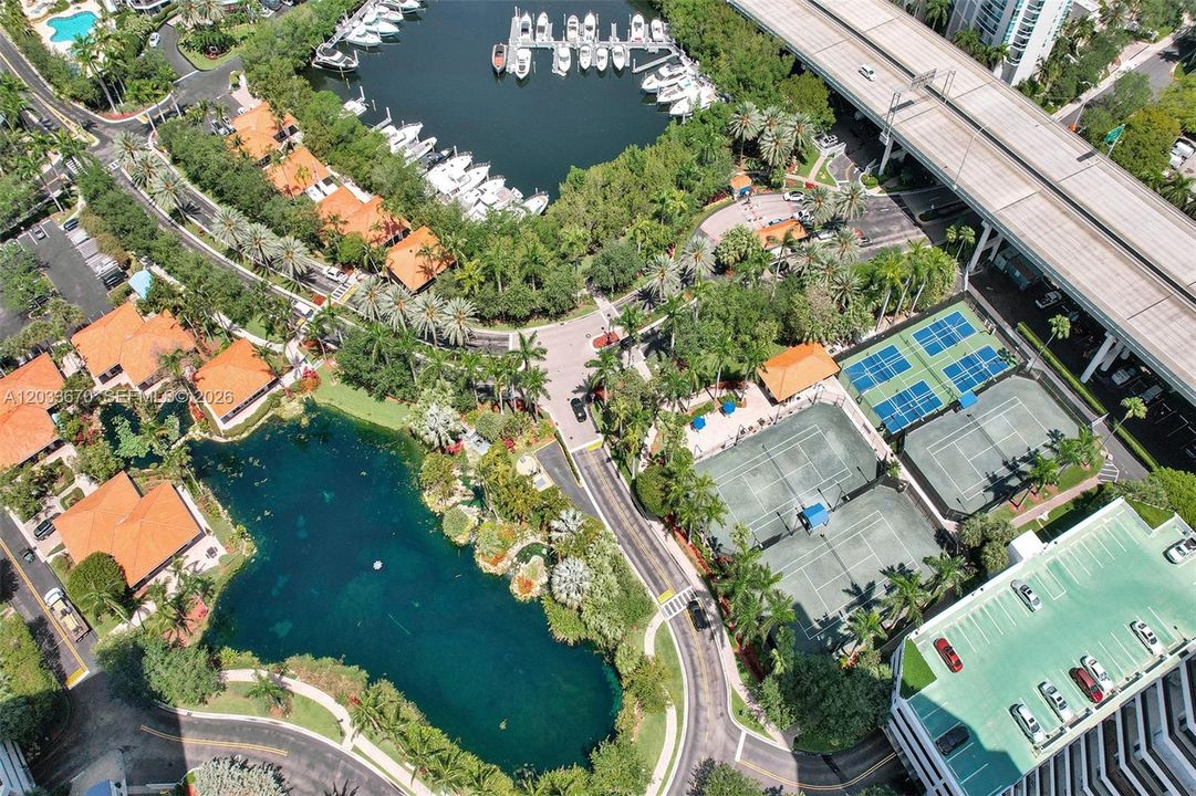 Country club living at its best with tennis courts, pickleball courts, basketball court, Marina, restaurant, beauty salon and dog park.