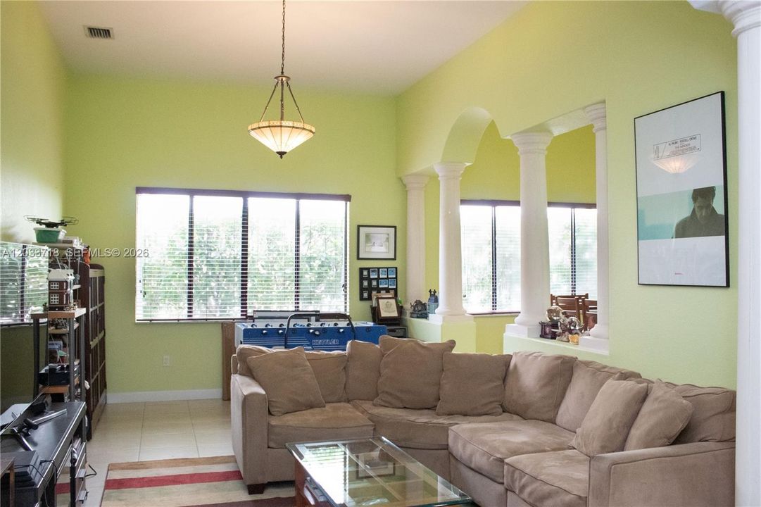 Formal Living Room is huge and offers expansive high ceilings and so much natural light. It connects to the Formal Dining room