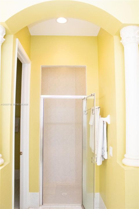 Directly opposite the bathtub wall, and adjacent to the separate room for the toilet and bidet, there is a separate shower which is level with the floor of the bathroom so there is no step up or step down.