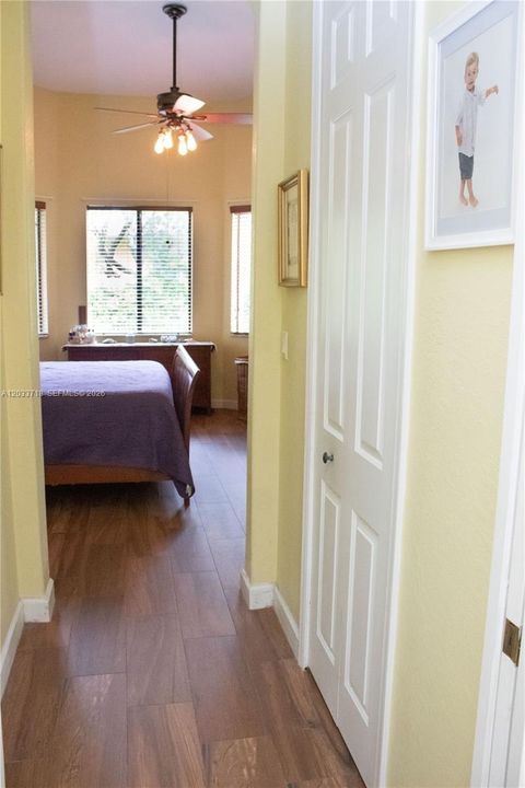 There is a very spacious, deep and very high closet in the Primary Bedroom with Elfa Shelving System