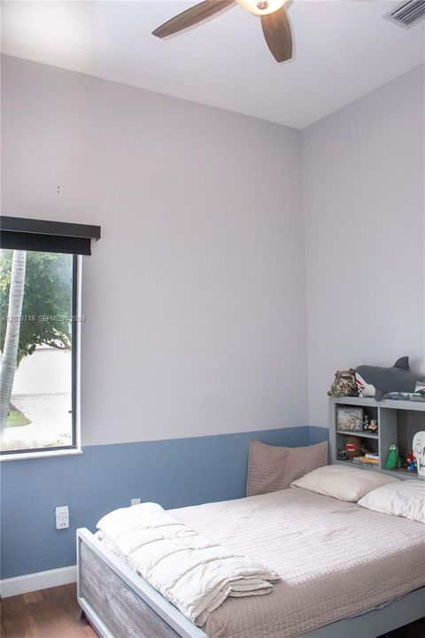The first bedroom is by the front of the home, on the left once you walk thru the front door. Soaring high ceilings are featured in ALL bedrooms.