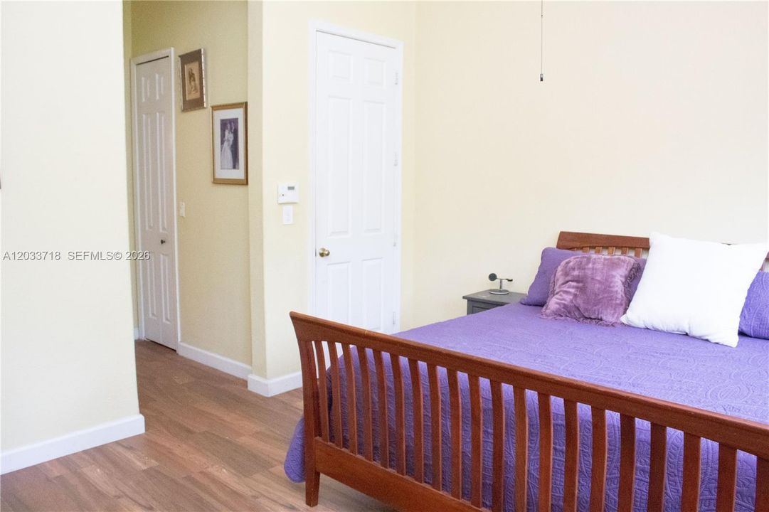 The Primary Bedroom has the same durable and beautiful Wood-Look Tile as the other 3 bedrooms. Both Closets in the Primary Bedroom also have this same Wood-Look Tile.