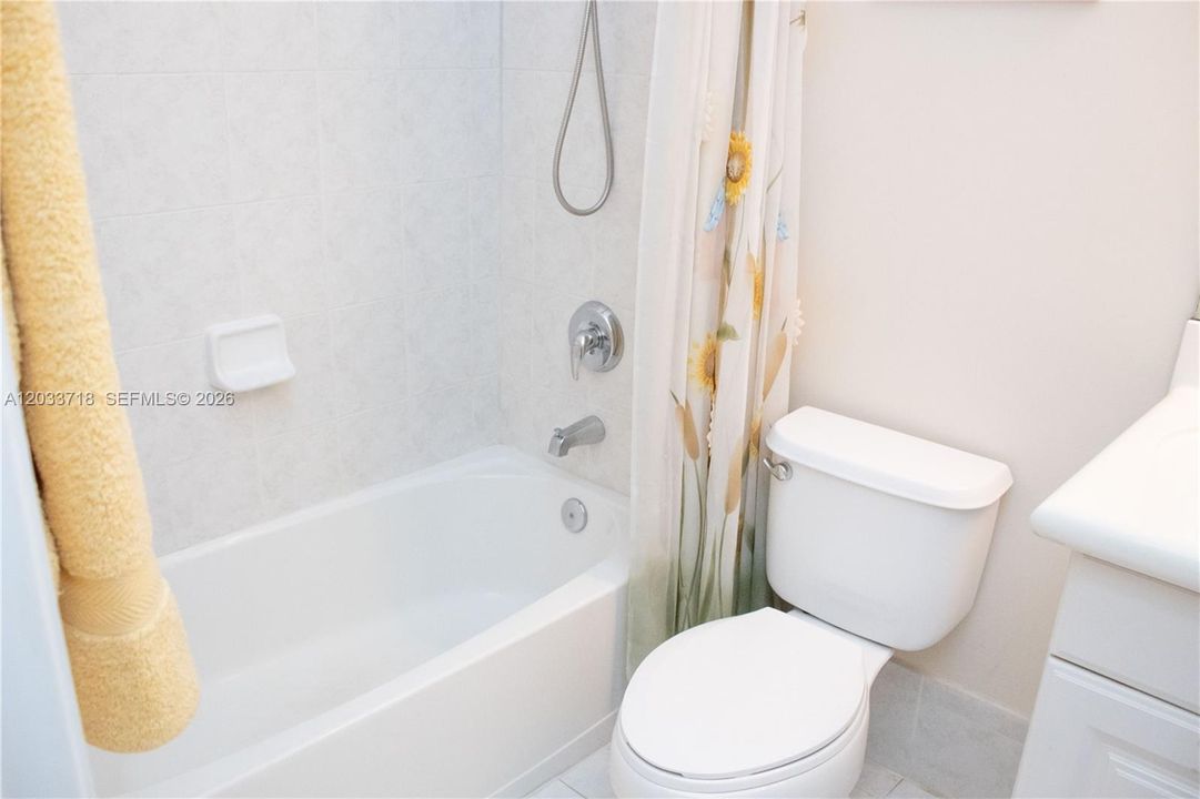 This is the 2nd bathroom, which is in the hallway that contains the Guest Room and Garage entrance.
