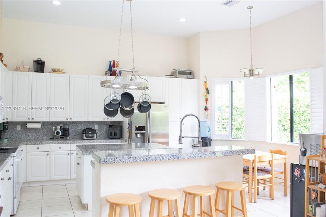 Kitchen Windows have  beautiful plantation shutters