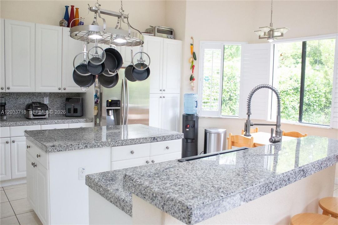 Kitchen Island has plenty of storage as well as convinient electricity outlet.