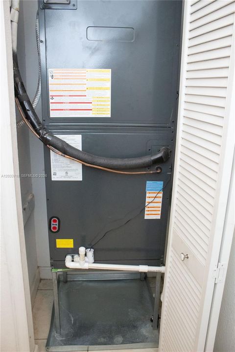 The AC is located in the hallway where the Guest Bedroom and Garage Entrance are, so none of the main bedrooms can hear the AC turning on or off. The layout of the entire home is so well thought out. This AC was installed in 2021.