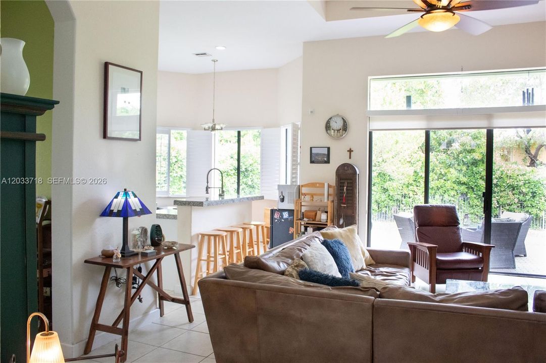 Spacious Family Room adjacent to kitchen, and the entry way you see on the left, leads to the Formal Dining Room