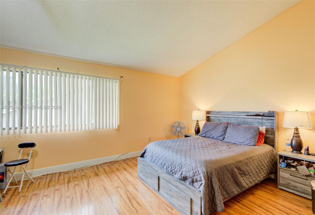 Primary bedroom has an abundance of natural light