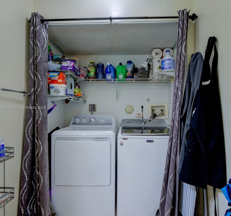 Half bath includes the laundry room, the curtain can fully enclose to hide the machines