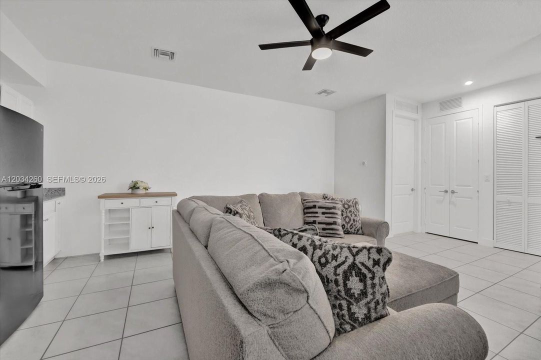 In law Living room and entry to private laundy closet.