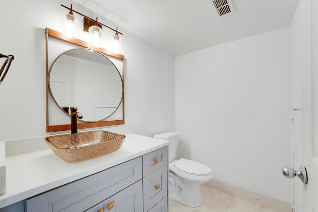 GUEST HALF BATH DOWNSTAIRS W/STORAGE