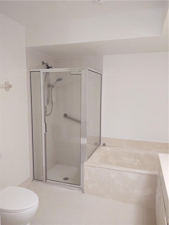 Shower in master bath with soaking tub