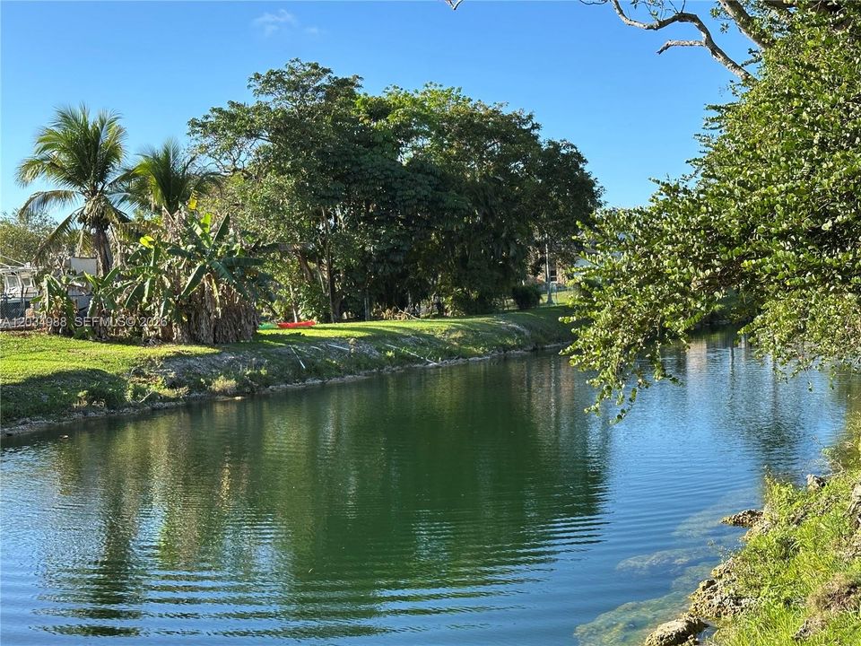 Waterfront. Wide canal on a back