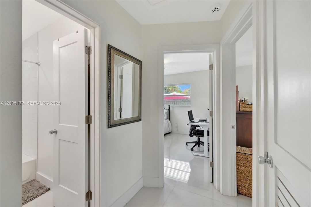 Hallway leads to the two bedrooms
