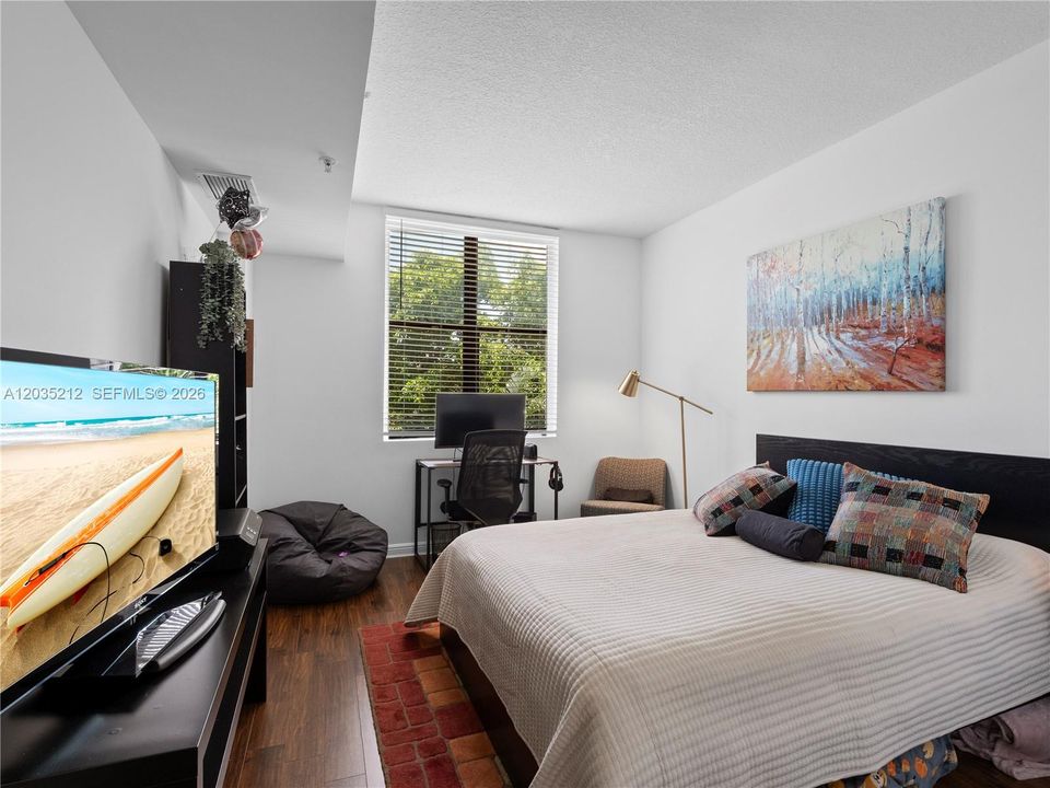 SECOND BEDROOM WITH CUSTOM BUILT WALK-IN CLOSET