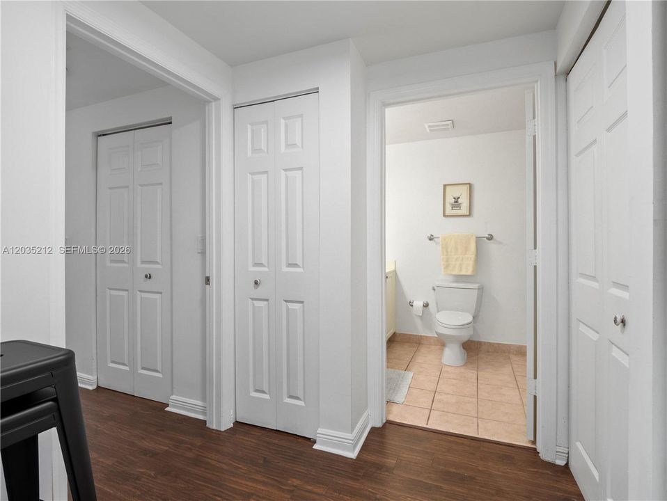 ENTRANCE TO SECOND BEDROOM WITH CUSTOM BUILT WALK-IN CLOSET AND SECOND BATHROOM