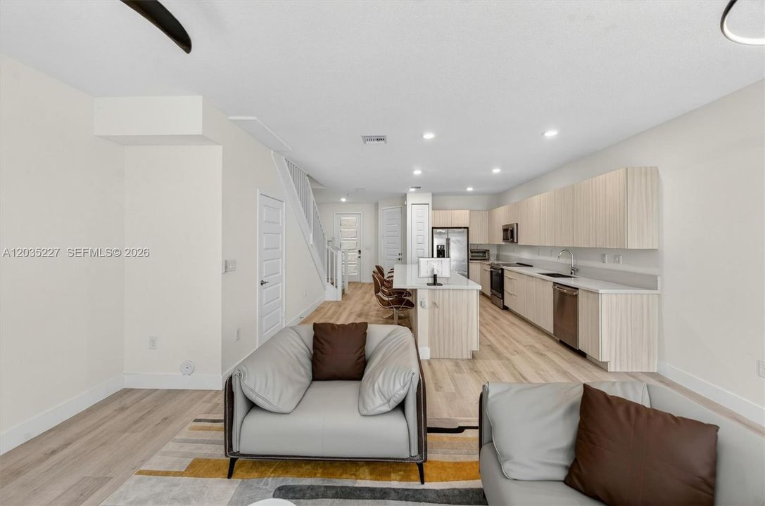 Living and dining room combo seamlessly flows into the chef's kitchen.