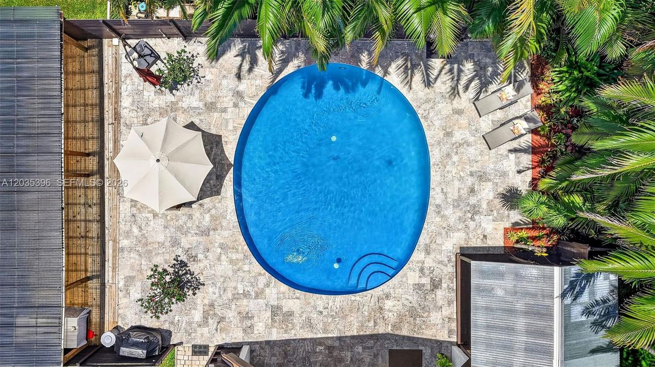 Travertine Deck surrounding beautiful large pool