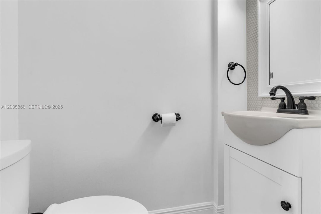 HALF BATHROOM ON FIRST FLOOR