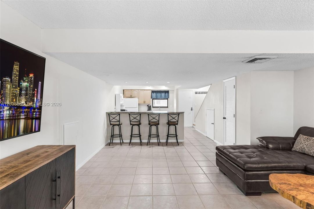OPEN CONCEPT FAMILY ROOM WITH BAR.