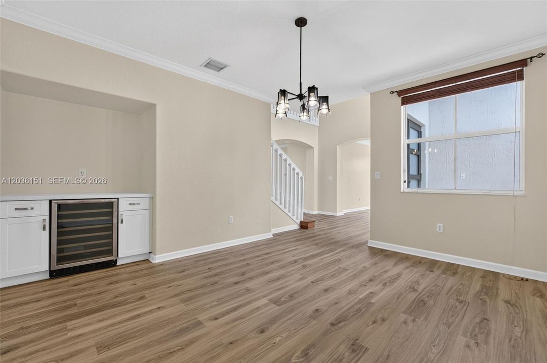 Formal dining, custom cabinet that includes a wine cooler