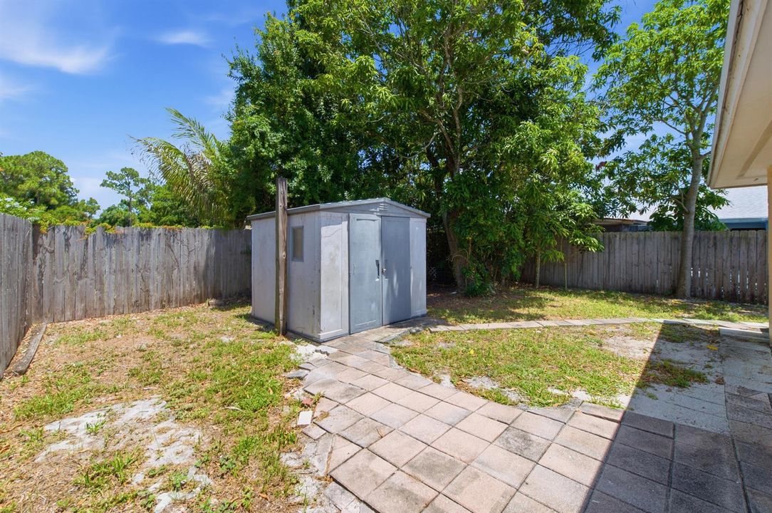 Utility Barn in Fenced Backyard