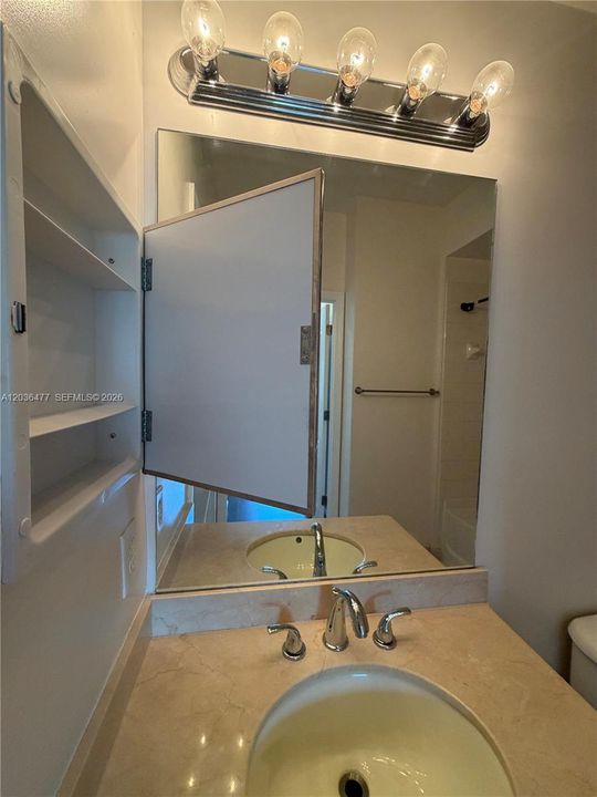 medicine cabinets in each bathroom