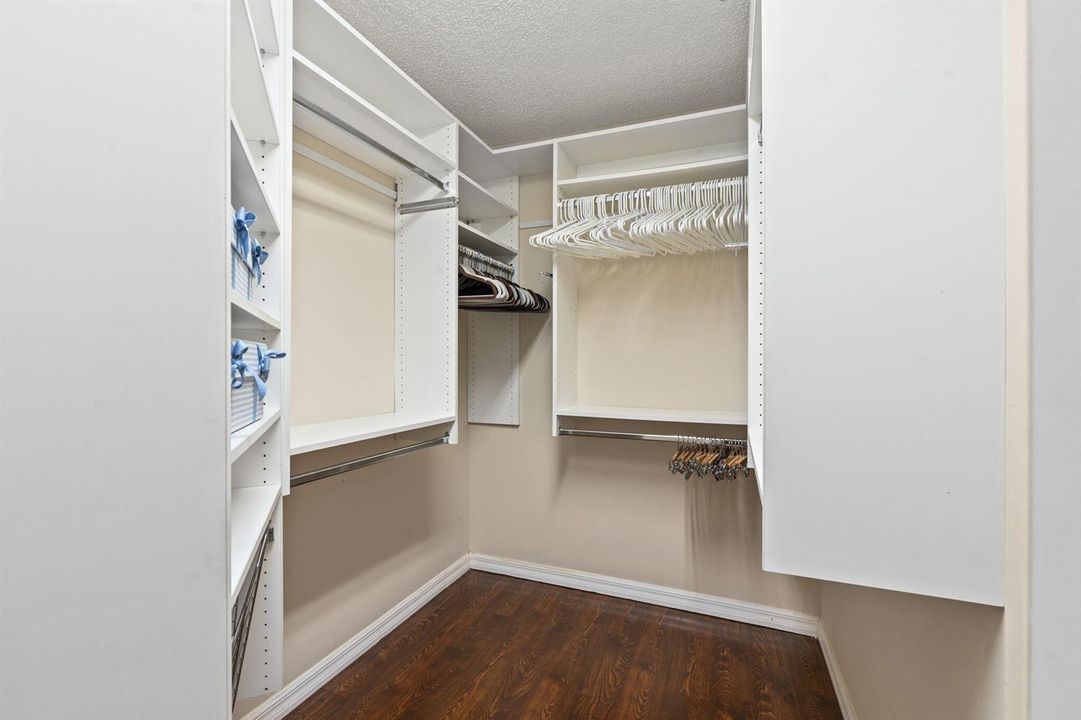 CUSTOM CABINETS IN MASTER CLOSET