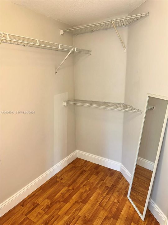 WALK IN CLOSET IN PRIMARY BEDROOM